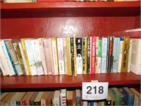 Entire shelf of paperback fiction books