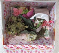 decorative box with assorted small craft items