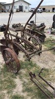 Antique 2 bottom moldboard plow, steel wheels