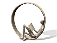 Encircled Reader Iron Sculpture