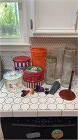 Tupperware orange flour container, tins, glass