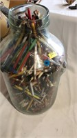 Jar of pens and pencils