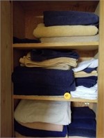 CABINET FULL OF BATH TOWELS AND CLOTHS