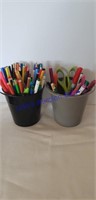 2 plastic buckets and w/ pencils, markers & etc