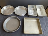 lot of bread and pie pans