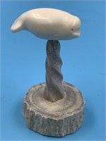 Ivory whale, on a antler base, 3" tall, x 1.5" lon
