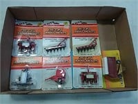 assortment of ERTL 1/64 scale implements
