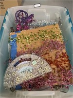Tote full of string beads, various colors and