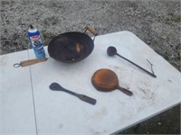6 1/2" cast-iron skillet. Cast-iron ladle