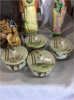Set of four lidded Asian Bowls