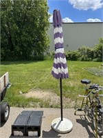 Purple and white patio umbrella with umbrella