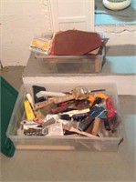 Assorted painting supplies in totes