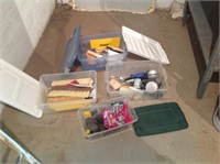 Assorted painting supplies in tubs