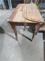 table with fold down sides, one side broken off