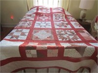 Handmade quilt shown on Queen bed