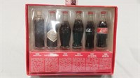 Evolution of the Coca Cola contour bottle set