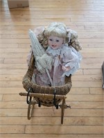 Vintage Porcelain Doll with Wooden Carriage