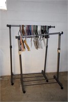 (2) Rolling clothes racks w/ hangers (mostly