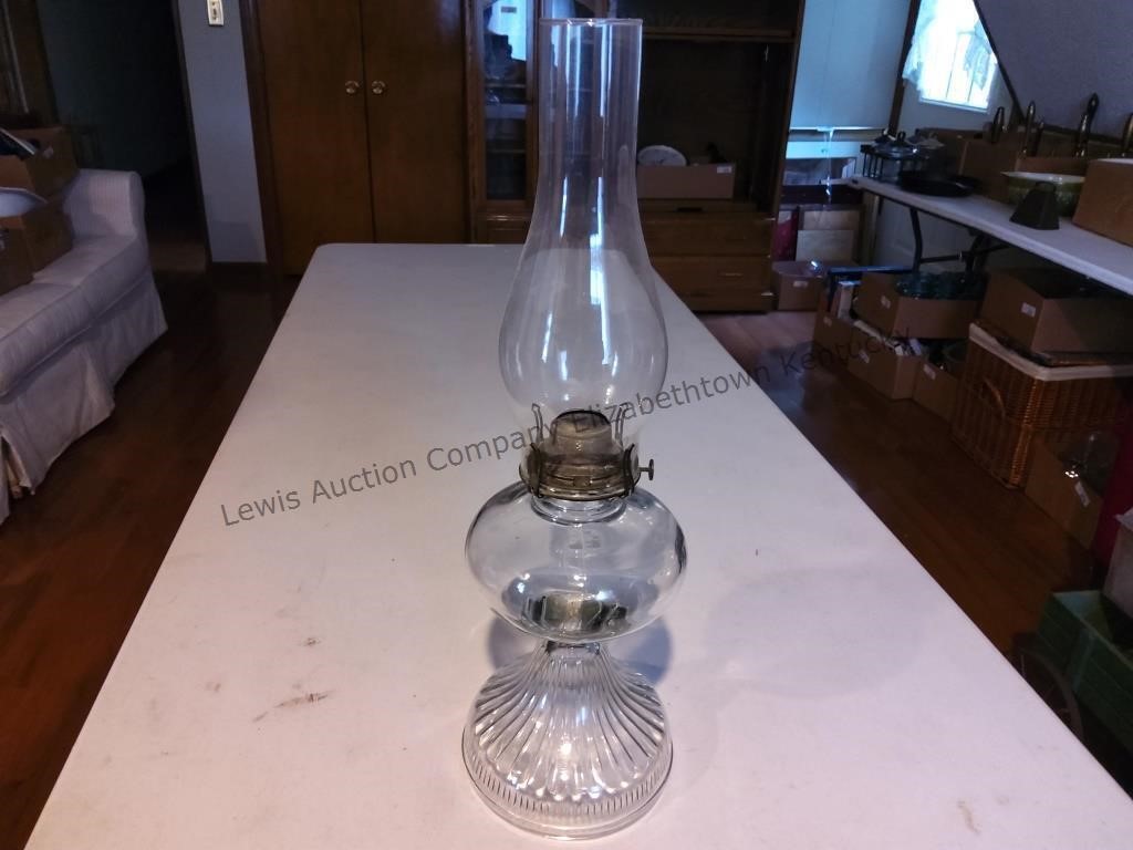 Old clear glass oil lamp without wick