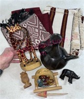 Pottery teapot, carved giraffe & textiles (LR)