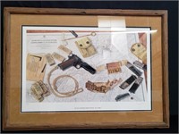 Signed print of 1911 pistol in wood frame
