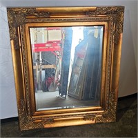 Gold framed mirror