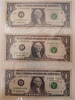 Three US $1 Bills