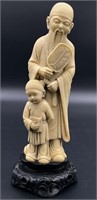 Asian Man With Boy Sculpture on Stand