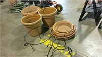 Large plastic flower pots with saucers and