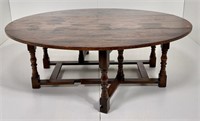 Oak drop leaf coffee table, oval top, Jacobean