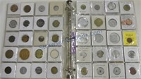 Three ring binder with foreign coins,