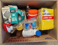 box of cleaning supplies and light bulbs