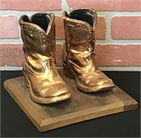 Copper Color Children's Boots on Wood Display