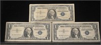 Three 1957 Blue Seal $1 Silver Certificates