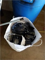 Bag of hockey helmets and gloves.