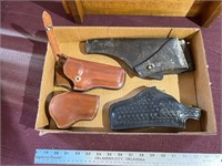 Flat of leather holsters