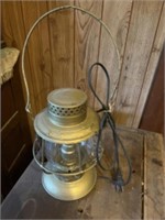 Appears to be an antique lantern converted to