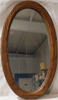 Wood framed oval mirror