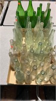 3 Flats of 46 Glass Bottles of Varying Sizes and