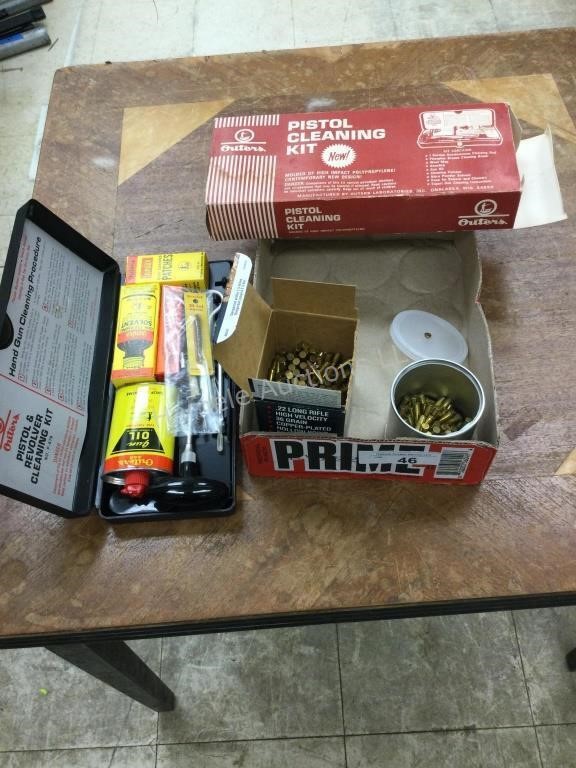 2 containers 22 lr ammo and pistol cleaning kit