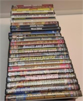 (26) DVDS IN CASES MOSTLY WESTERNS.