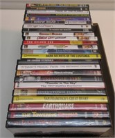 (24) DVDS IN CASES. NICE.