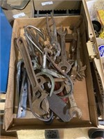 assorted tools including wrenches and pliers and