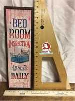 Light wood bedroom inspection wall hanging