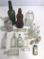 Assorted antique and vintage bottles and jars.