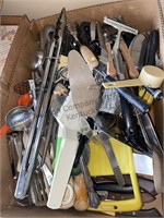 Box and small plastic tote of kitchen utensils