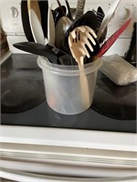 KITCHEN UTENSILS WITH A CONTAINER