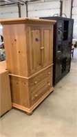 Wood entertainment center with drawers-