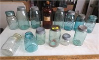 Several old blue canning jars