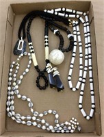 7 black & white necklaces incl Monet & Trifari